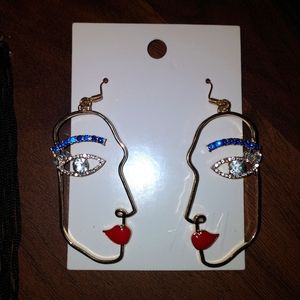 H & M face earrings